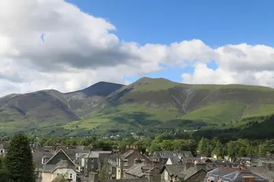 a town with houses and mountains in the background at Strathmore Guest House in Keswick