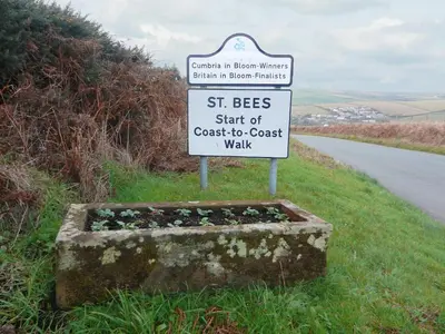 a sign on a road that says st bees start of coast to coast walk at The Byres Methera in St Bees