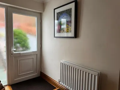 a room with a door and a picture on the wall at The Haven in Keswick
