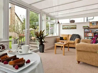 a living room with a table with food on it at Littlebeck Warren in Whitehaven