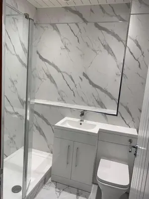 a bathroom with a toilet and a sink and a shower at Welltrees Apartments 10 Dailly Road in Maybole