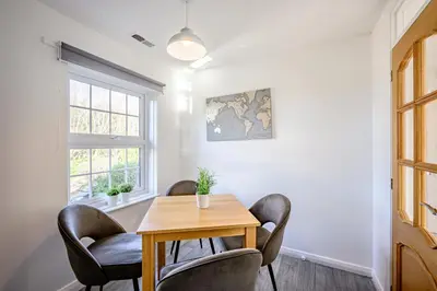 a dining room with a table and chairs at Cosy Apartment in Wetheral,Cumbria in Wetheral