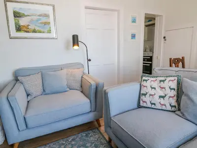 a living room with two chairs and a couch at Greystones in Newton Stewart
