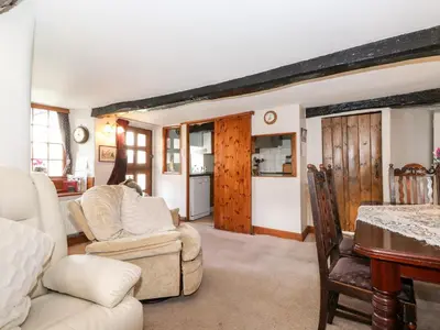 a living room with a couch and a table at Castle Lodge in Keswick