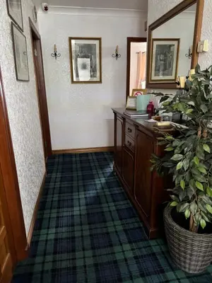 a bathroom with a vanity and a potted plant at Prince Charlie's Cottage in Gretna Green