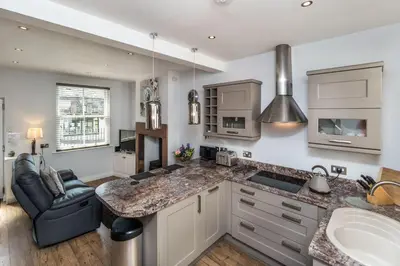 a kitchen with a sink and a counter top at Isabel Cottage in Keswick