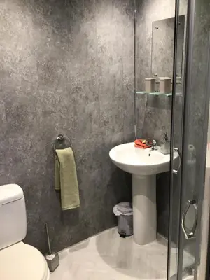a bathroom with a sink and a toilet at Ravensworth House in Keswick