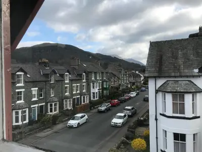 a view of a town with cars parked on a street at Winchester House in Keswick