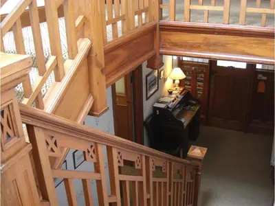 an overhead view of a wooden staircase in a house at Hamilton House in Dumfries