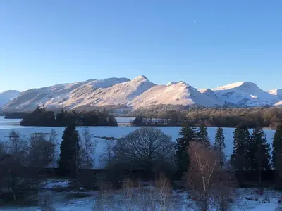 a view of a lake with snow covered mountains at Crow Park Hotel in Keswick