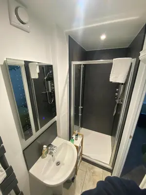 a bathroom with a sink and a shower at Claremont House Keswick in Keswick