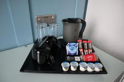 a black tray with a blender on a counter at Marina View Guest House in Irvine