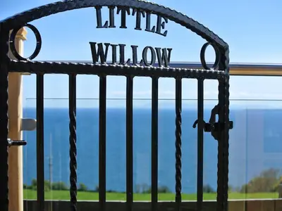 a metal gate with the words white window at Little Willow - Uk5998 in Carsluith