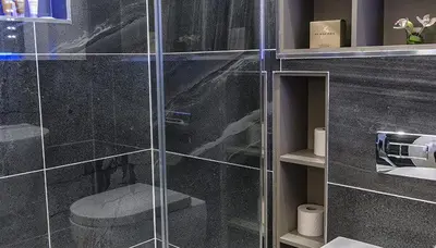 a bathroom with a glass shower with a toilet at Ram Lodge in Moffat