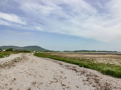 a dirt road in the middle of a field at Mardan in Dumfries