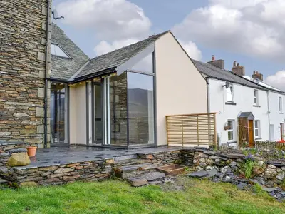 an external view of a house with a deck at Cottam Road in Threlkeld