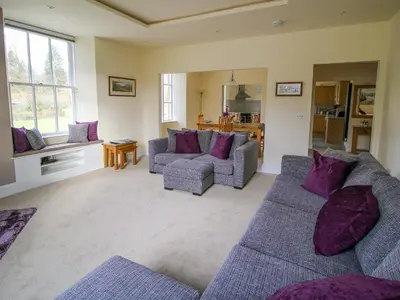 a living room with two couches and purple pillows at Easedale Corner in Grasmere