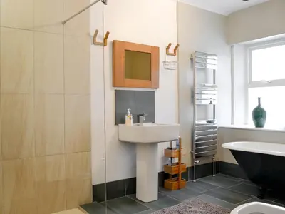 a bathroom with a sink and a shower at Kingswood in Whitehaven