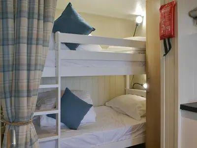 a couple of bunk beds in a room at Merlin's Cabin in Westward