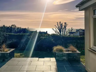 a sunbeam shining through a window of a yard at Saffron in Portpatrick
