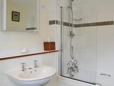 a bathroom with a sink and a shower at Saffron in Portpatrick