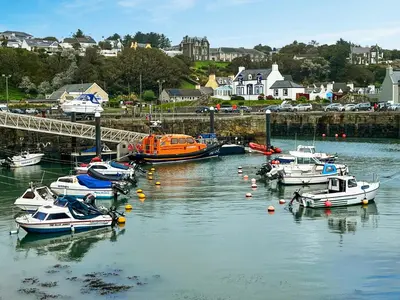 a group of boats are docked in a harbor at Saffron in Portpatrick
