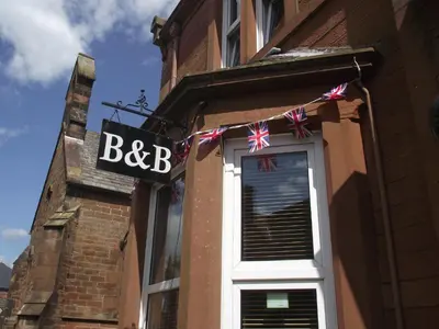 a bbc sign on the side of a building at The Old Rectory in Annan