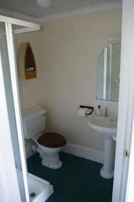 a bathroom with a toilet and a sink at The Old Rectory in Annan