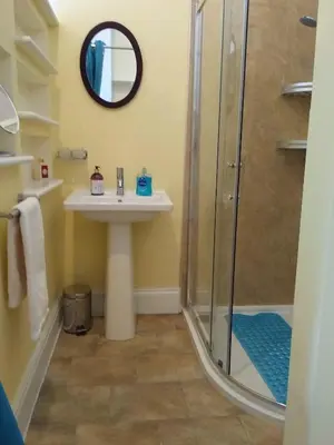 a bathroom with a sink and a shower at Green View Guest House in Silloth