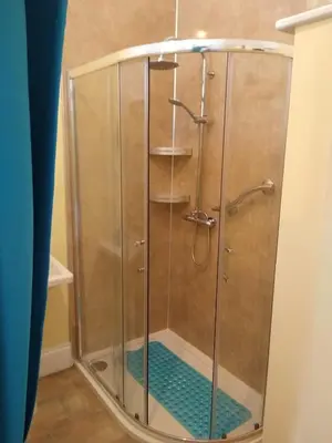 a shower with a glass enclosure in a bathroom at Green View Guest House in Silloth