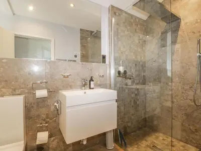a bathroom with a sink and a shower at Stair Cottage in Keswick