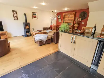 a large living room with a kitchen and a living room at Stonegarth Mews in Ambleside