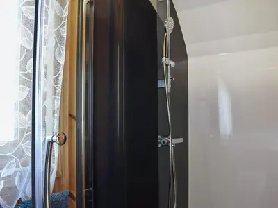 a shower with a glass door in a bathroom at Black Coombe-Uk1392 in Corney