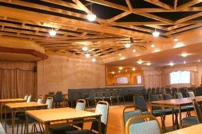 a large room with tables and chairs in it at Aberdour Guest House in Dumfries