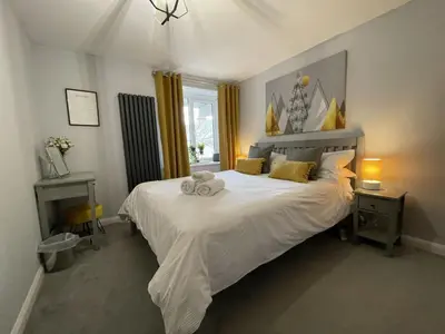 a bedroom with a bed with a stuffed animal on it at Fellseeker in Keswick