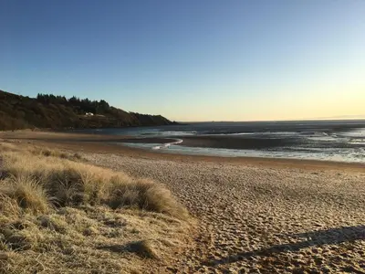 a view of a beach with the ocean at STUNNING LODGE - HOME FROM HOME Kippford, Dalbeattie in Dalbeattie