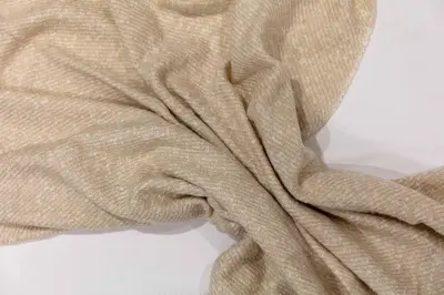 a brown blanket laying on a white background at Elliot Suite No 1 - Donnini Apartments in Ayr