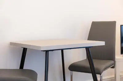 a table and two chairs in an office at Elliot Suite No 1 - Donnini Apartments in Ayr