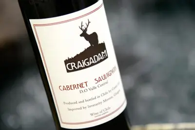a bottle of red wine with a deer on the label at Craigadam Country House Hotel in Kirkpatrick Durham