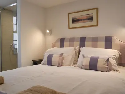 a bedroom with a bed with two pillows on it at Apple Barn in Applethwaite