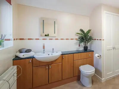 a bathroom with a sink and a toilet at Apple Cross in Keswick