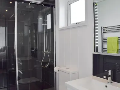 a bathroom with a shower and a toilet and a sink at Cree Lodge - Uk13636 in Creetown