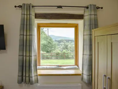 a window in a room with a view at Wyndham Cottage in Dean