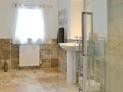 a bathroom with a sink and a shower at The Soup Kitchen in Borgue