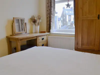 a bedroom with a bed and a window at Lake Road Heights in Keswick