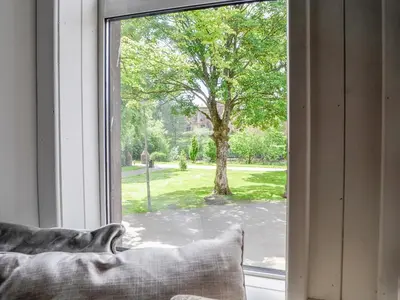 a window with a view of a tree at River View in Dumfries