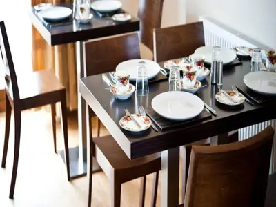 a dining table with plates and dishes on it at Bamflatt Farm Bed & Breakfast in Strathaven