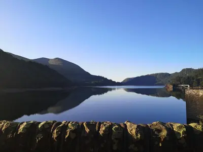 a view of a lake with mountains in the background at Stybeck Farm in Thirlmere