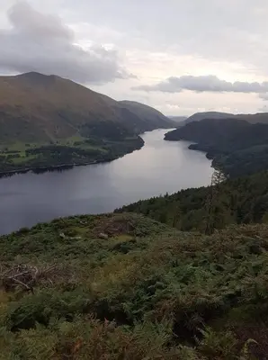 a view of a lake in the middle of a valley at Stybeck Farm in Thirlmere