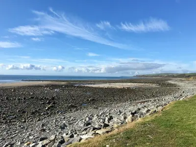 a large group of rocks on a beach at Saltlife Cottage in Port William